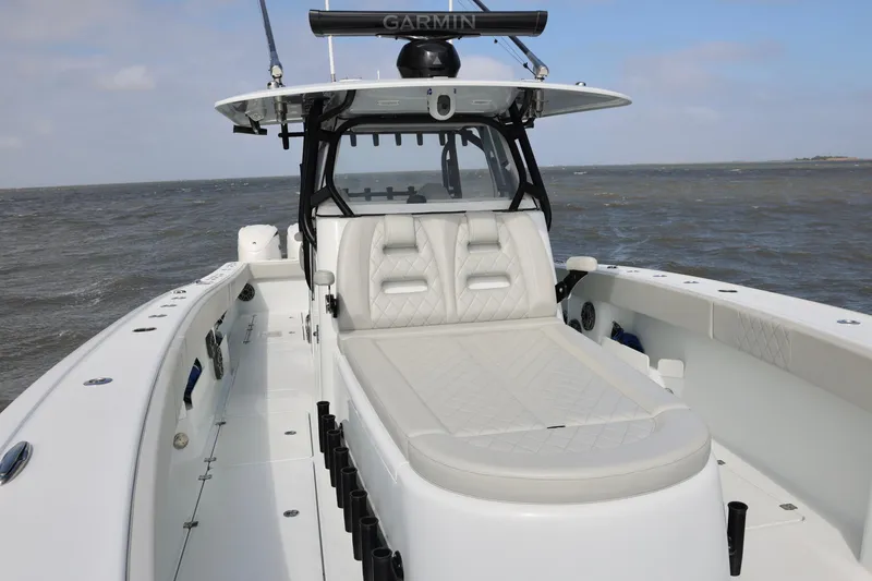 Slide: The Image of 2024 Freeman 38 boat with sleek design and spacious deck on open water. - 14