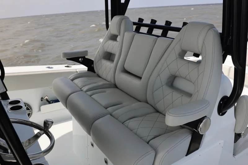 Slide: The Image of Luxurious seating on 2024 Freeman 38 boat with quilted upholstery and armrests. - 16