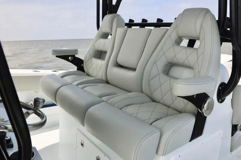 Slide: The Image of Luxurious seating on 2024 Freeman 38 boat with quilted upholstery and armrests. - 17