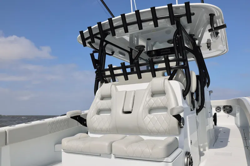 Slide: The Image of 2024 Freeman 38 boat with luxurious seating and modern design on open water. - 25