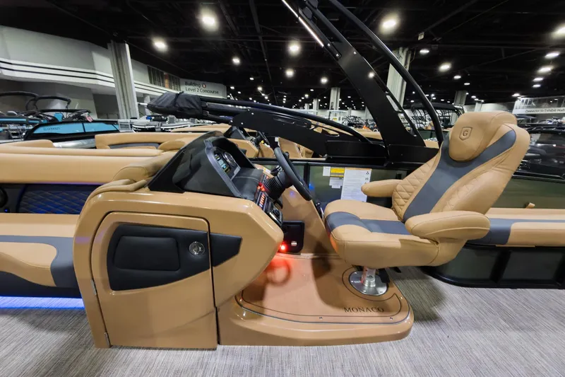 Slide: The Image of Luxurious interior of 2026 Godfrey Monaco 255 Single Flip Lounge boat, featuring plush seating and modern controls. - 11