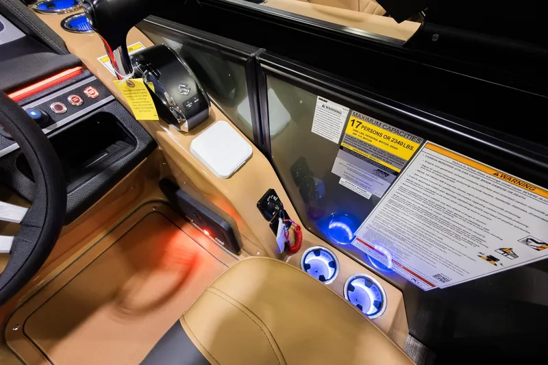 Slide: The Image of 2026 Godfrey Monaco 255 boat dashboard with controls and capacity warning labels. - 15