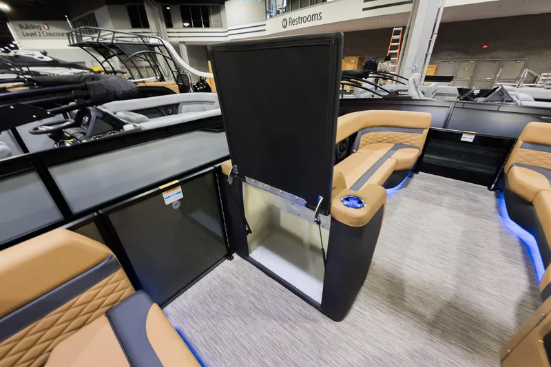 Slide: The Image of 2026 Godfrey Monaco 255 boat interior with flip lounge seating and modern design. - 19