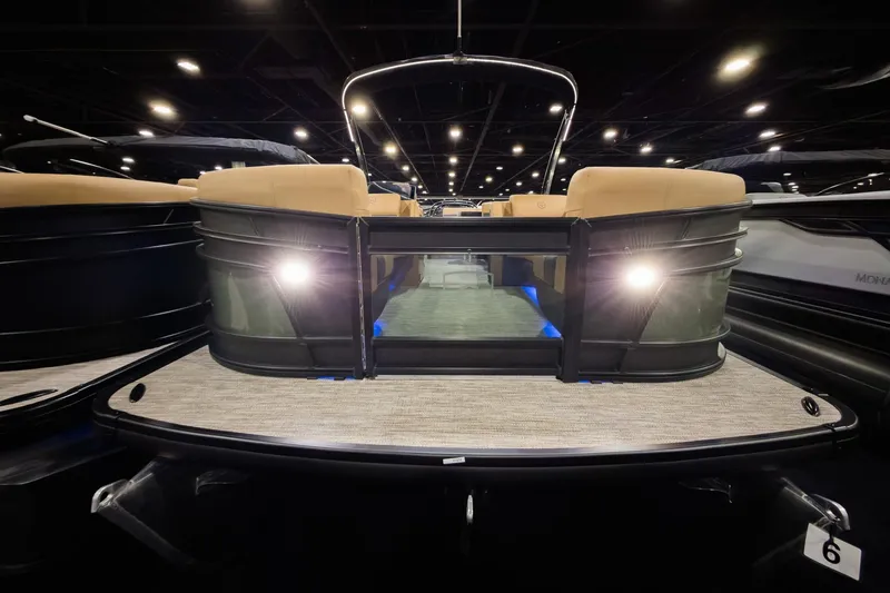 Slide: The Image of 2026 Godfrey Monaco 255 Single Flip Lounge pontoon boat with illuminated deck and seating. - 2