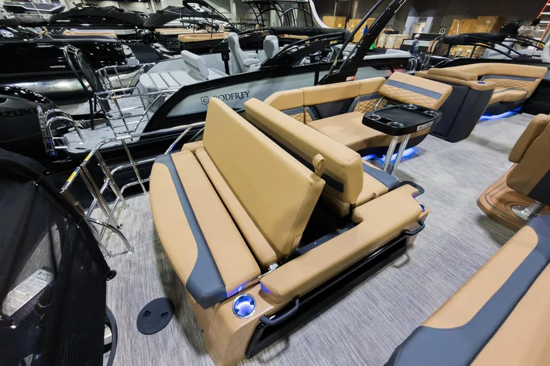 Slide: The Image of Luxurious 2026 Godfrey Monaco 255 boat interior with tan seating and modern amenities. - 24