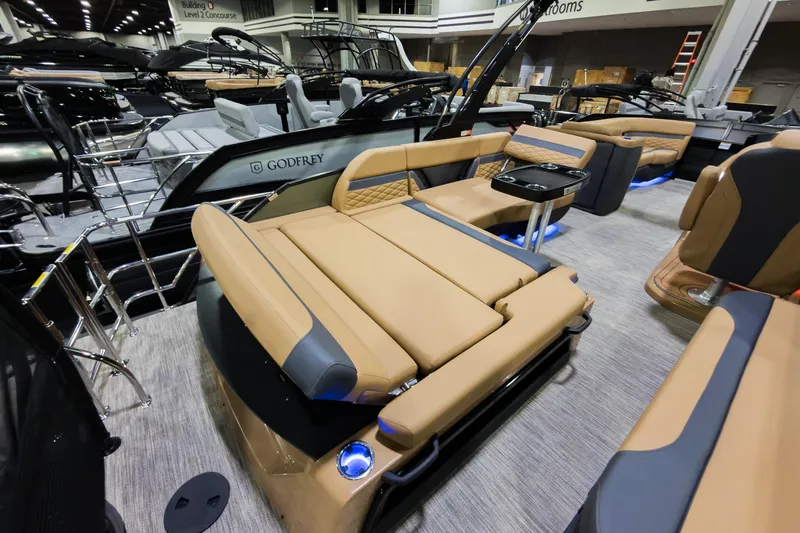 Slide: The Image of 2026 Godfrey Monaco 255 Single Flip Lounge boat with luxurious seating and modern design. - 26