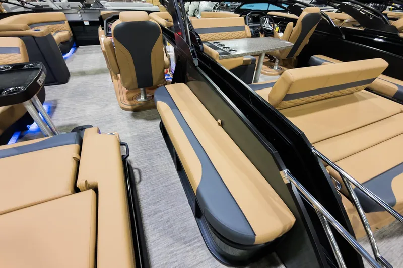 Slide: The Image of Luxurious interior of 2026 Godfrey Monaco 255 Single Flip Lounge boat with tan seating. - 27