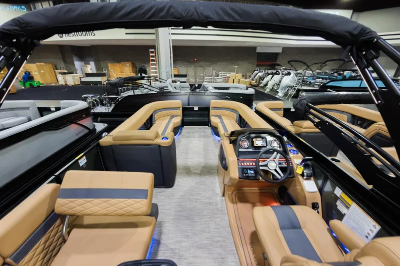 Slide: The Image of Interior view of 2026 Godfrey Monaco 255 Single Flip Lounge boat, featuring luxurious seating and modern dashboard. - 31