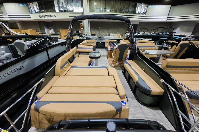 Slide: The Image of 2026 Godfrey Monaco 255 Single Flip Lounge boat interior with luxurious seating and modern design. - 33