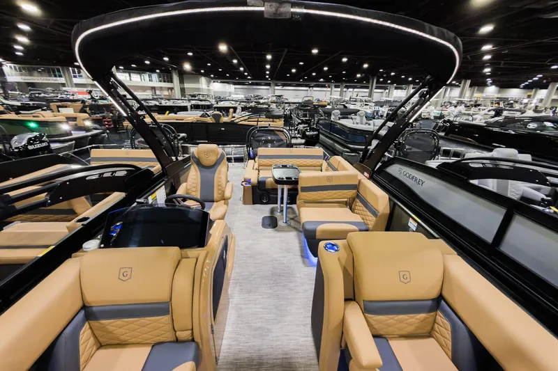 Slide: The Image of Luxurious 2026 Godfrey Monaco 255 boat interior with tan seating and modern design. - 9