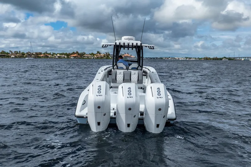Slide: The Image of 2025 Yellowfin 36 Offshore boat with triple 400 V10 engines on open water. - 14