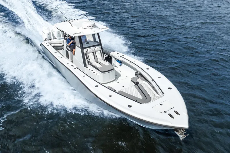 Slide: The Image of 2025 Yellowfin 36 Offshore boat cruising on open water, showcasing sleek design and performance. - 19