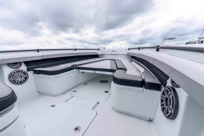 Slide: The Image of 2025 Yellowfin 36 Offshore boat interior with cushioned seating and modern design. - 27