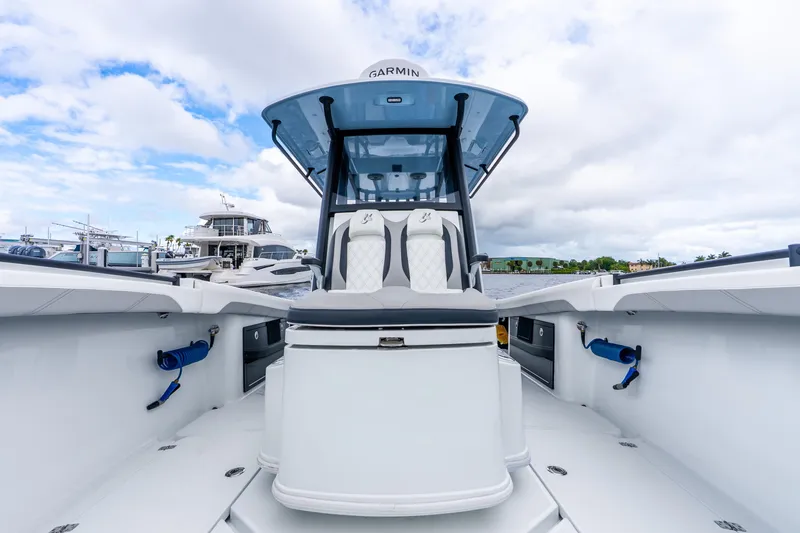 Slide: The Image of 2025 Yellowfin 36 Offshore boat with sleek design and modern features, docked at marina. - 29
