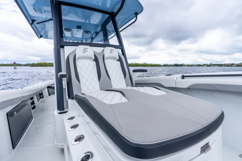Slide: The Image of 2025 Yellowfin 36 Offshore boat interior with luxurious seating and sleek design on open water. - 30