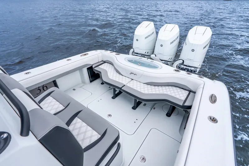 Slide: The Image of 2025 Yellowfin 36 Offshore boat with triple Mercury engines on open water. - 32