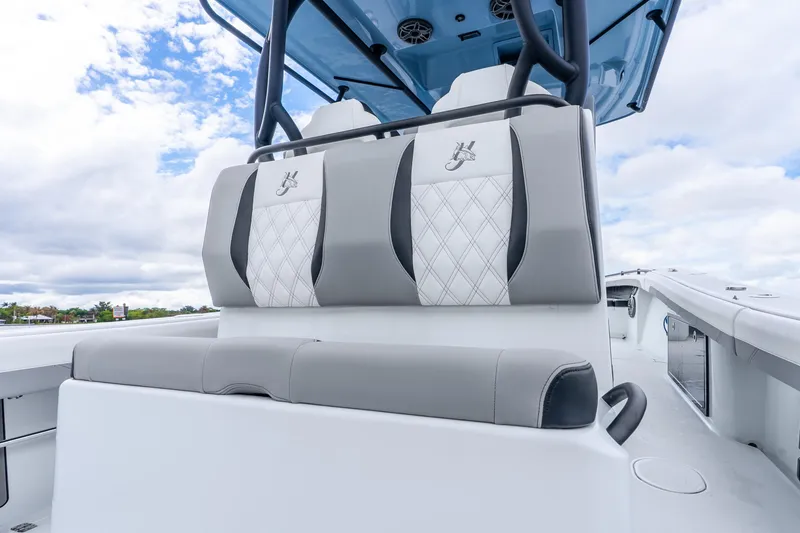 Slide: The Image of 2025 Yellowfin 36 Offshore boat interior with cushioned seating and sleek design. - 35