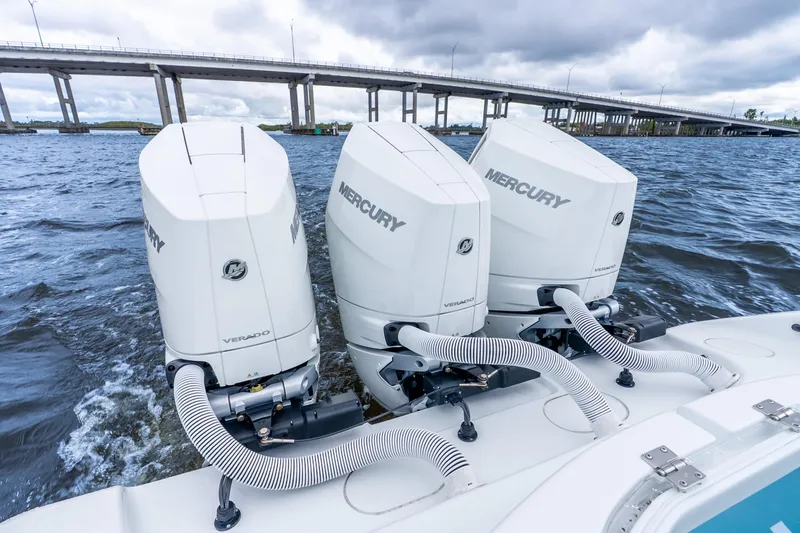 Slide: The Image of 2025 Yellowfin 36 Offshore boat with triple Mercury Verado engines on water. - 36