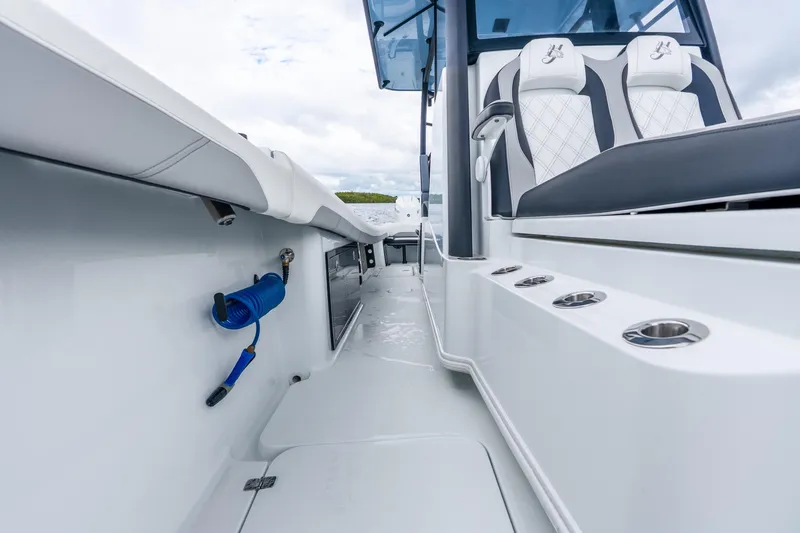 Slide: The Image of 2025 Yellowfin 36 Offshore boat interior with seating and rod holders. - 39