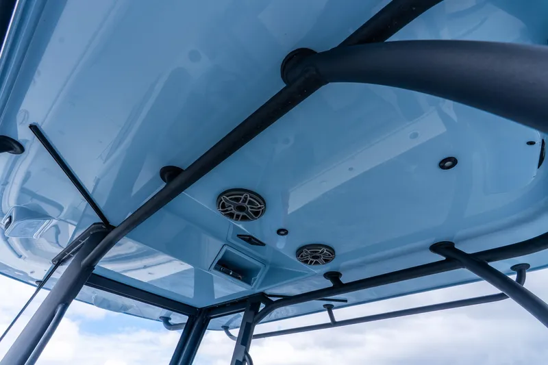 Slide: The Image of 2025 Yellowfin 36 Offshore boat's underside view with speakers and support bars. - 40