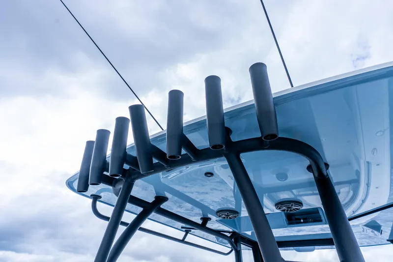 Slide: The Image of Rooftop rod holders on 2025 Yellowfin 36 Offshore boat against cloudy sky. - 42