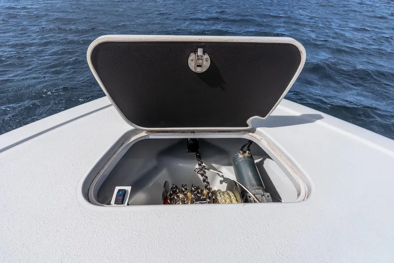 Slide: The Image of Open anchor hatch on 2025 Yellowfin 36 Offshore boat, showing chain and rope storage. - 44
