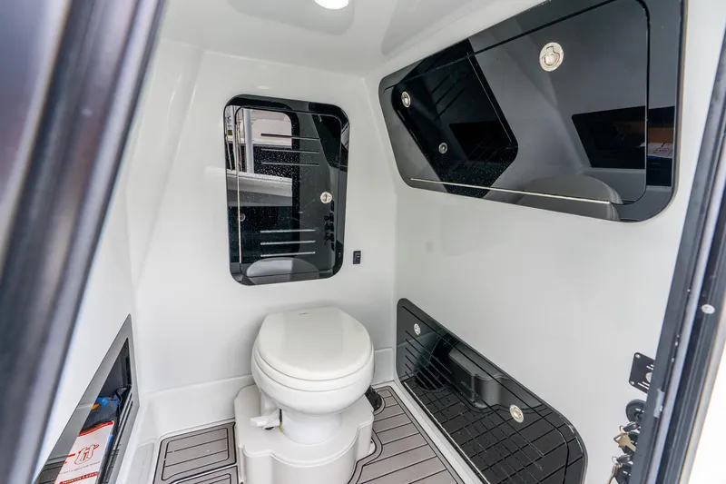 Slide: The Image of 2025 Yellowfin 36 Offshore boat interior bathroom with modern fixtures and storage. - 45