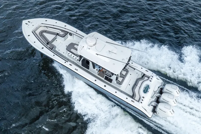 Slide: The Image of 2025 Yellowfin 36 Offshore boat cruising on open water, showcasing sleek design and powerful engines. - 5