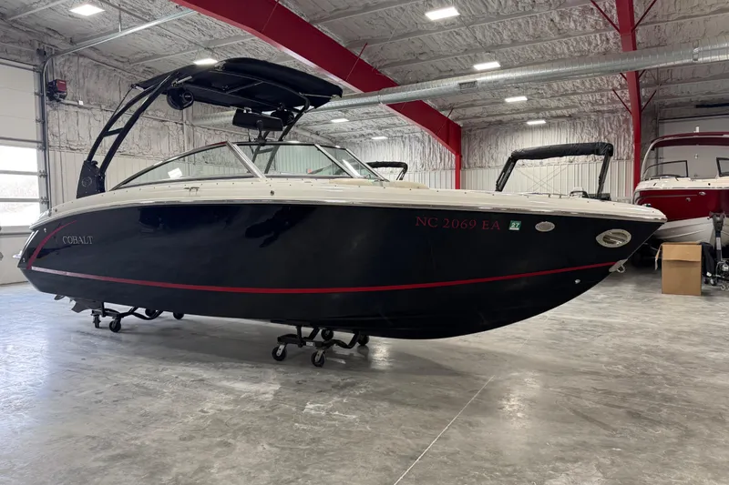The Image of 2014 Cobalt R5 boat in a spacious indoor storage facility. - 1