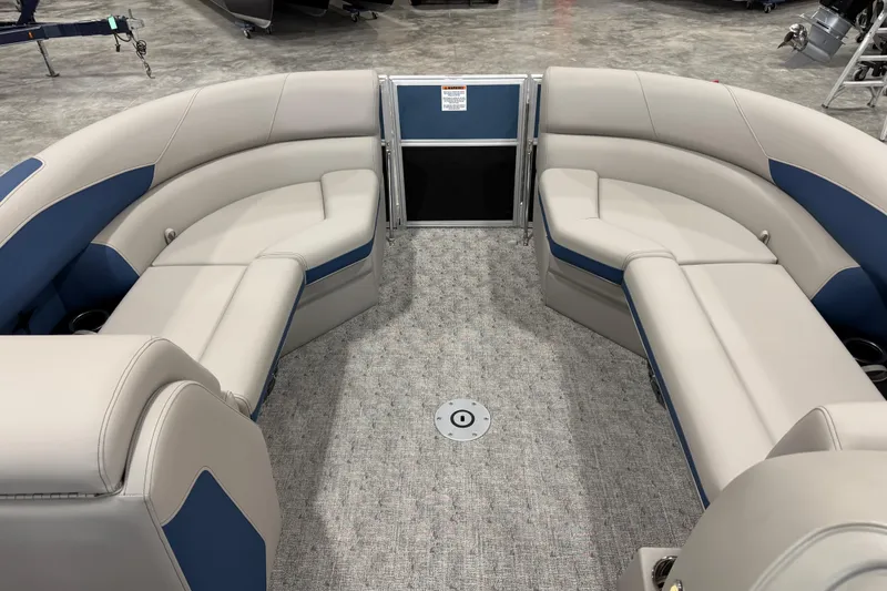 Slide: The Image of 2026 Berkshire 24 UL RE pontoon boat interior with plush seating and modern design. - 13