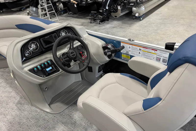 Slide: The Image of 2026 Berkshire 24 UL RE boat interior with steering wheel and control panel. - 14