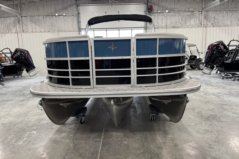 Slide: The Image of 2026 Berkshire 24 UL RE pontoon boat in a showroom, front view. - 5