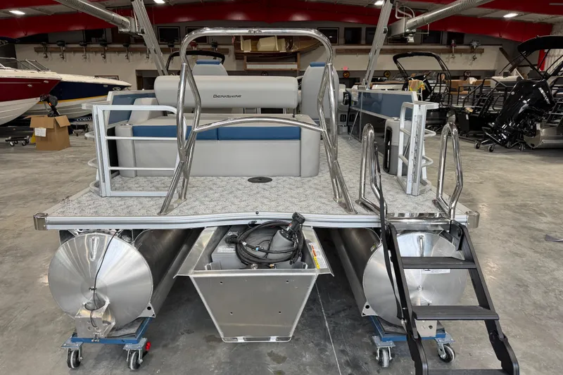 Slide: The Image of 2026 Berkshire 24 UL RE pontoon boat in showroom, featuring sleek design and modern amenities. - 6