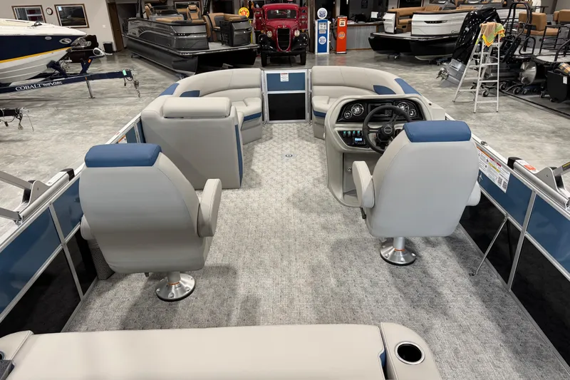 Slide: The Image of 2026 Berkshire 24 UL RE pontoon boat interior with modern seating and steering console. - 7