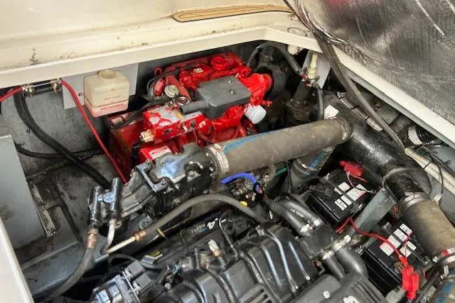 Slide: The Image of Engine compartment of a 2009 Meridian 391 Sedan, showcasing mechanical components and wiring. - 16