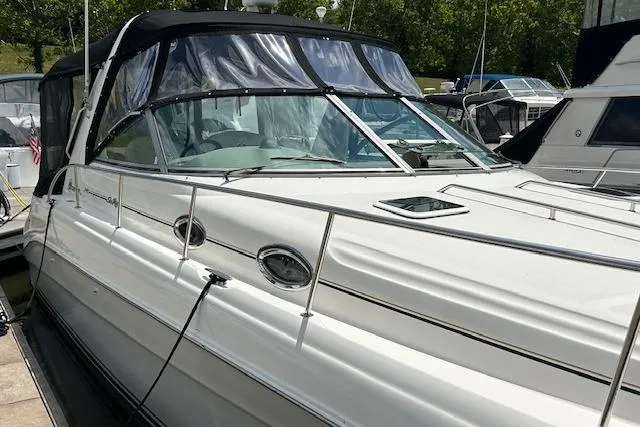 Slide: The Image of 2009 Meridian 391 Sedan yacht docked, featuring sleek design and spacious cabin. - 3