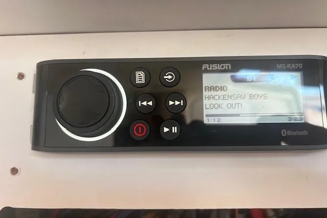 Slide: The Image of Fusion MS-RA70 stereo displaying "Hacksaw Boys - Look Out!" on a 2009 Meridian 391 Sedan. - 7