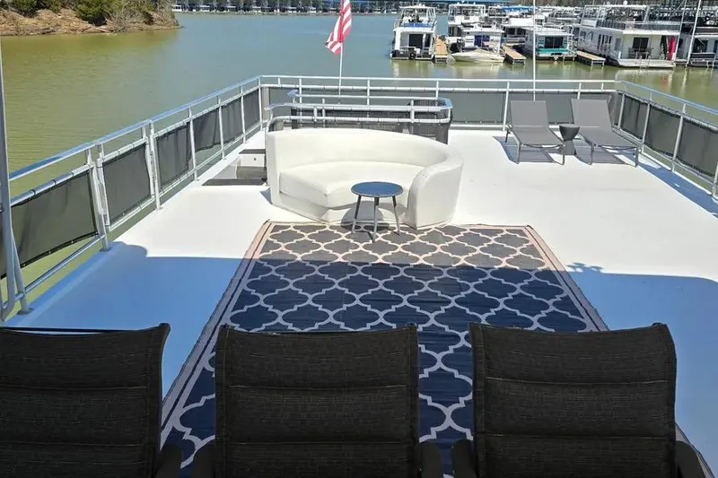 Slide: The Image of Spacious deck of 2012 Thoroughbred Houseboat 21x103 with seating and lake view. - 13