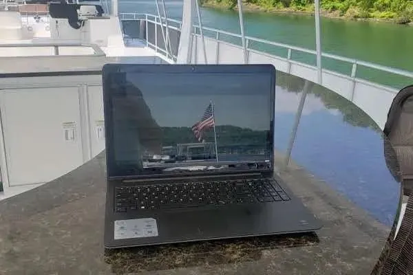 Slide: The Image of Laptop on Thoroughbred Houseboat 21x103, 2012, with scenic river view. - 14