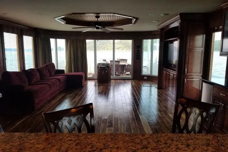 Slide: The Image of Luxurious 2012 Thoroughbred Houseboat interior with elegant wood flooring and panoramic windows. - 2