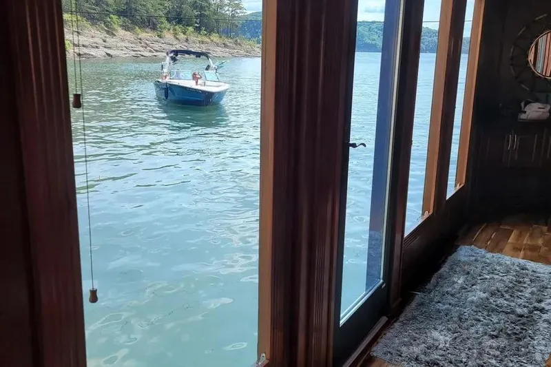 Slide: The Image of Houseboat interior view with lake and boat, Thoroughbred Houseboat 21x103, 2012 model. - 4