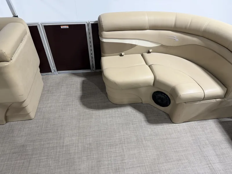 Slide: The Image of Interior of a 2016 Bennington 20SLX with beige leather seating. - 10