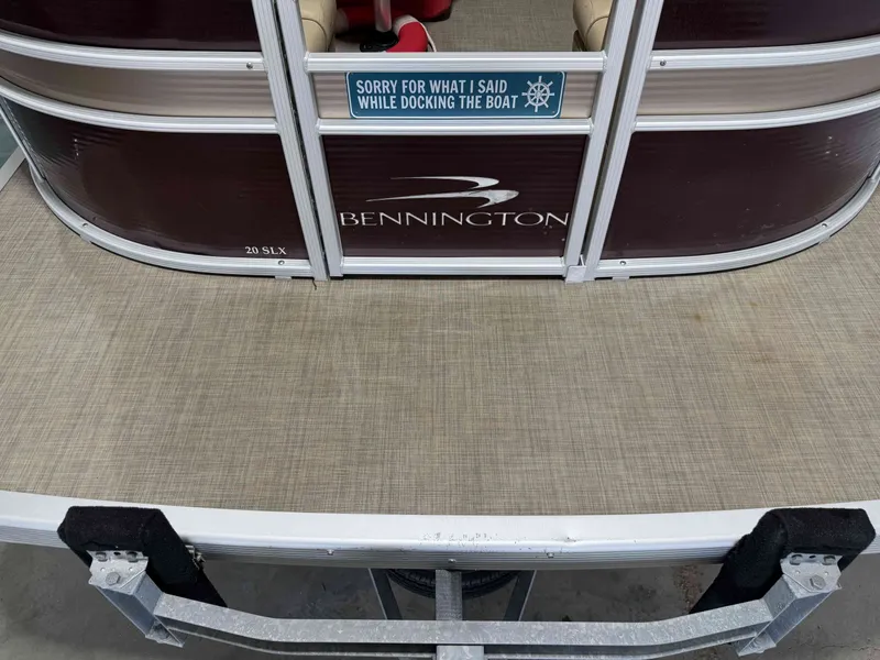 Slide: The Image of Bennington 20SLX pontoon boat with humorous sign at the stern. - 16