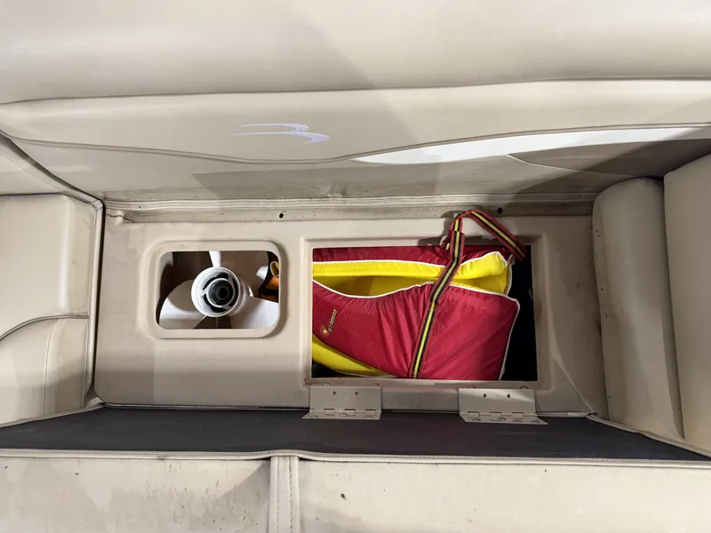 Slide: The Image of Storage compartment in 2016 Bennington 20SLX with life jacket. - 23