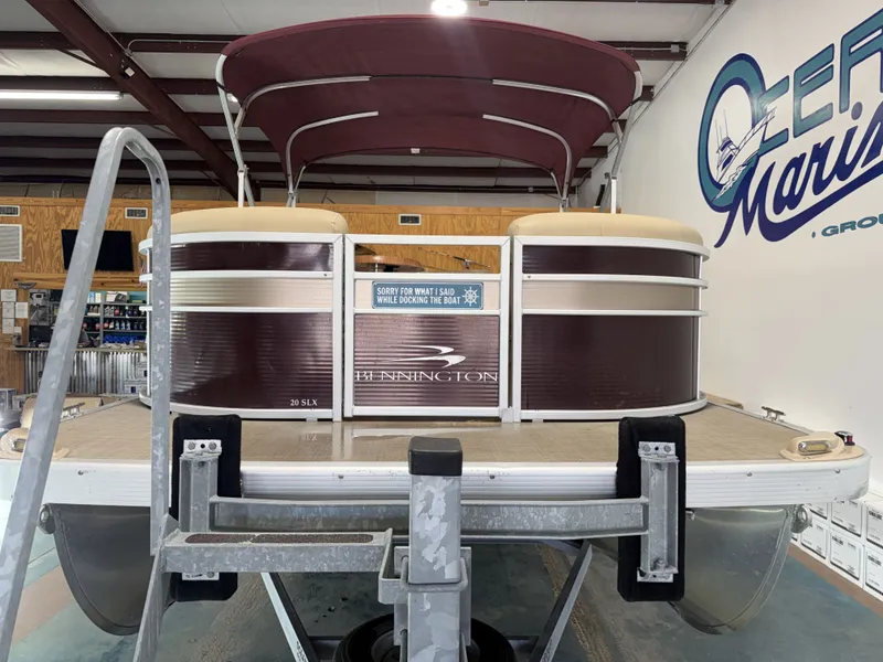 Slide: The Image of 2016 Bennington 20SLX pontoon boat in a workshop. - 5