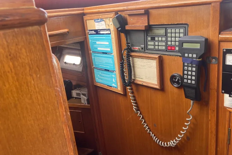 Slide: The Image of Interior of 1986 Island Gypsy 40 Motor Yacht with navigation equipment and wooden paneling. - 24