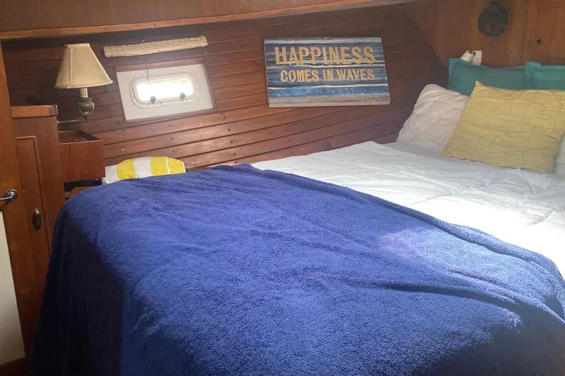 Slide: The Image of Cozy cabin interior of 1986 Island Gypsy 40 Motor Yacht with nautical decor. - 42
