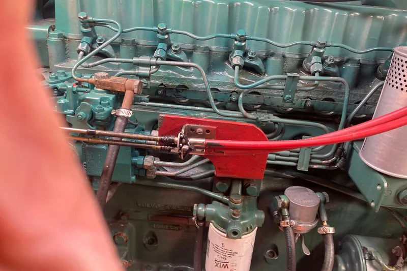 Slide: The Image of Engine components of a 1986 Island Gypsy 40 Motor Yacht, featuring intricate piping and filters. - 46