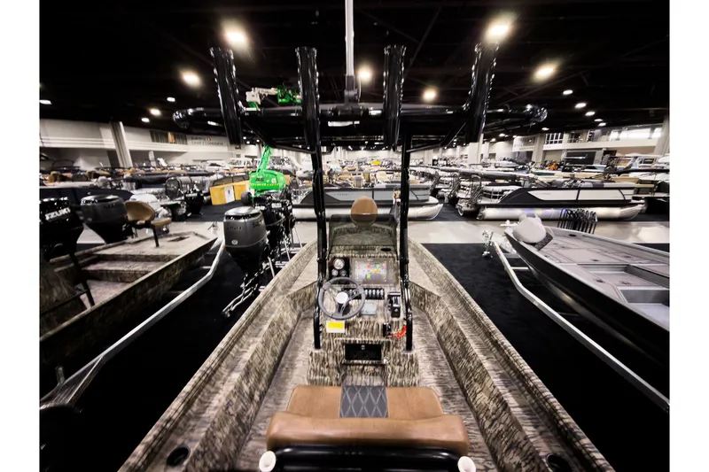 Slide: The Image of Interior view of Excel 220 Bay Pro Elite 2026 at a boat show. - 4