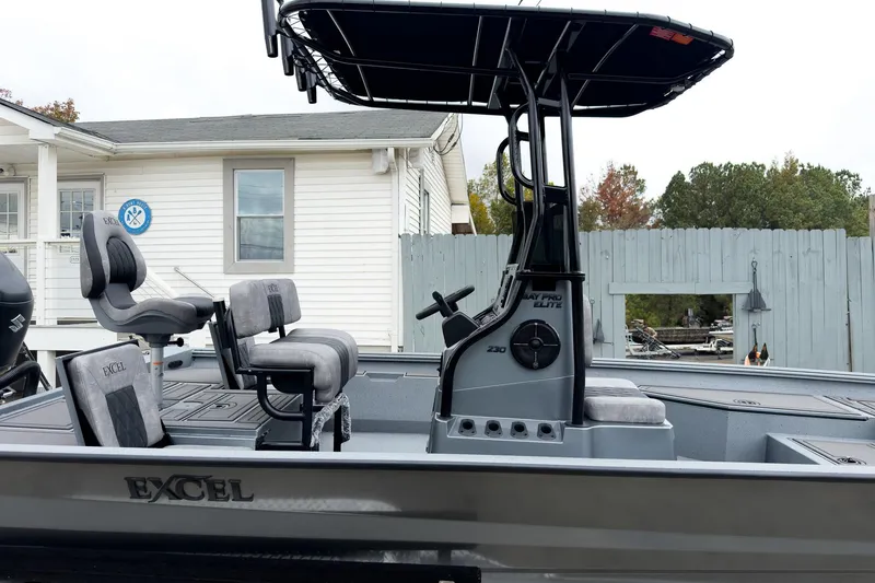 Slide: The Image of 2026 Excel Bay Pro Elite 230 boat with sleek design and comfortable seating. - 16